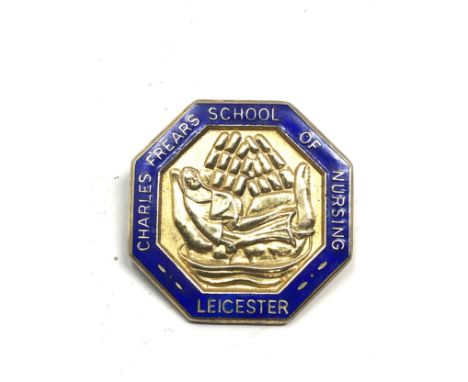 A silver and enamel nurses badge from the Charles Frears School of Nursing in Leicester 