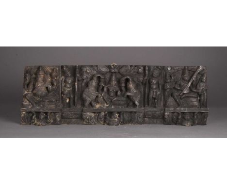 A carved ebonised wood architectural fragment, Southern IndiaFirst half 20th century, carved in high relief with a scene of d