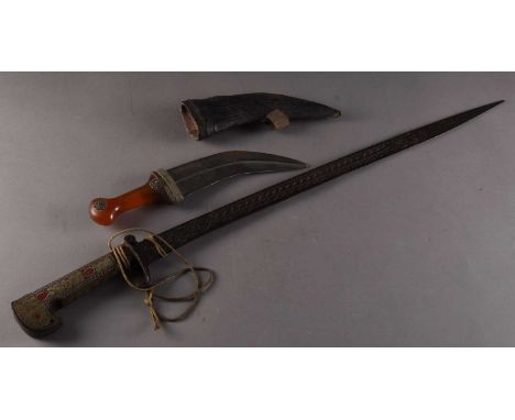 An Algerian decorative sword20th century, the hilt inlaid with wirework decoration, the 62cm blade incised with arabesques, t