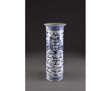 A Chinese blue and white sleeve vase, 19th centuryDecorated with confronting dragons chasing a flaming pearl amid stylised cl