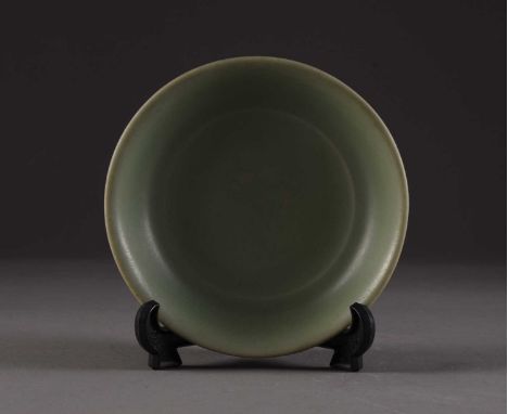 A Chinese Longquan brush washer, Ming DynastyOf shallow round form, covered in a celadon green glaze.15cm dia.Provenance:Priv