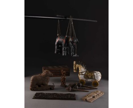 An assembled group of Indian wood carvings, 18th-20th centuryIncluding: A figure of the recumbent Nandi bull, 16cm long; a pa