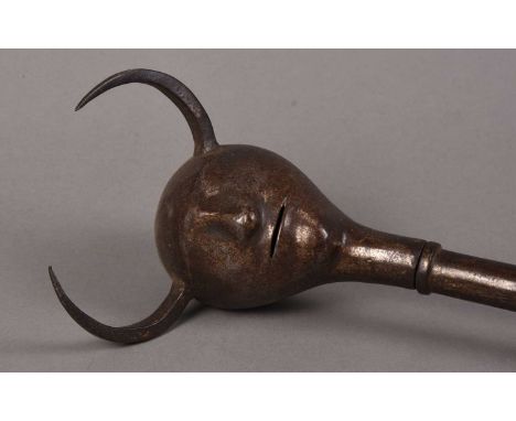 A Persian Devil's head mace, Qajar Dynasty, 19th centuryWith a horned stylised head finial on a 61cm shaft terminating in a r