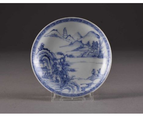 A Chinese blue and white saucer from the Ca Mau shipwreck Of plain round form, decorated with a landscape with pavilions nest