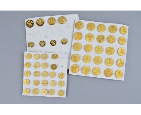 THREE CARD TRAYS CONTAINING A NUMBER OF GOLD COLOURED BRITISH ARMY UNIFORM BUTTONS, large and small, mostly Royal Artillery, 