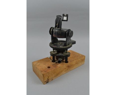A BRITISH MADE A.M. ASTRO COMPASS MKII, 6A. 1174. 3-H, this compass is mounted on a wooden plinth, this compass came into ser