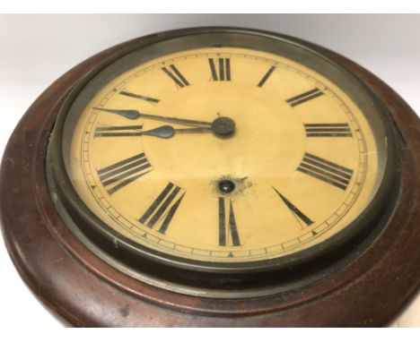 A mahogany case wall clock the circular dial with Roman numerals.