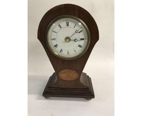 An Edwardian mantle clock with inlay the circular dial with Roman numerals.