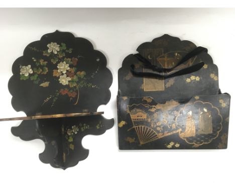 A Japanese lacquered letter rack and a Victorian lacquered wall shelf (2).