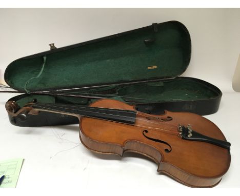 An Early 20th century Violin and bow in a wood case. The violin with the internal applied label Copy of a Antoninius Stradiva