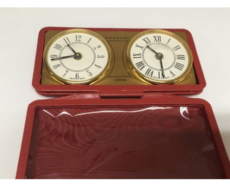 A vintage Garrard folding travelling cased alarm clock. No reserve.