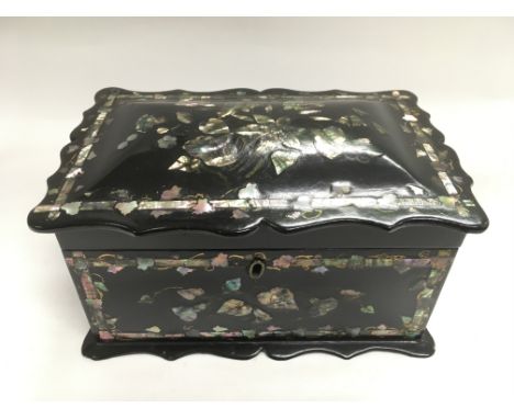 A Victorian papier mache tea caddy with mother of pearl inlay, approx 22cm x 11cm x 15cm.