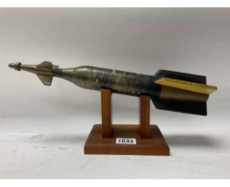A model of a Mortar mounted on a wooden stand.
