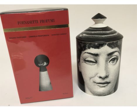 Two Fornasetti ceramic candle holders unused one in presentation packaging. (2)