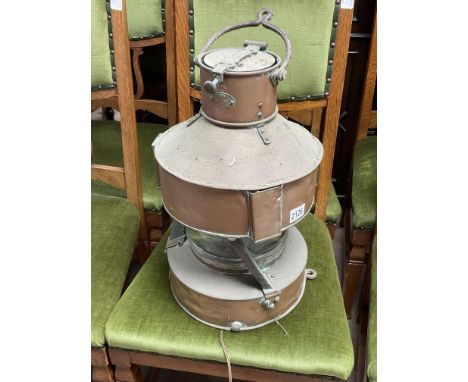 A large vintage ships navigation lantern.