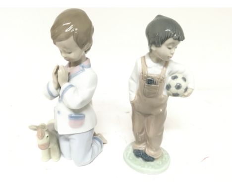 A Lladro figure bed time prayers and a Nao figure of a young boy with a football (2) no obvious damage.