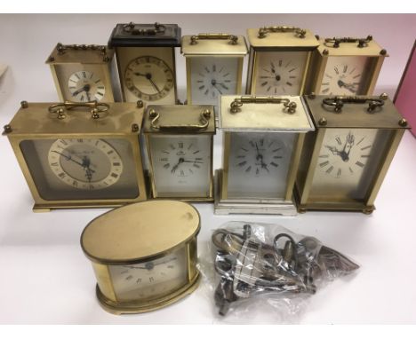 A box of brass carriage clocks and a collection of clock keys.