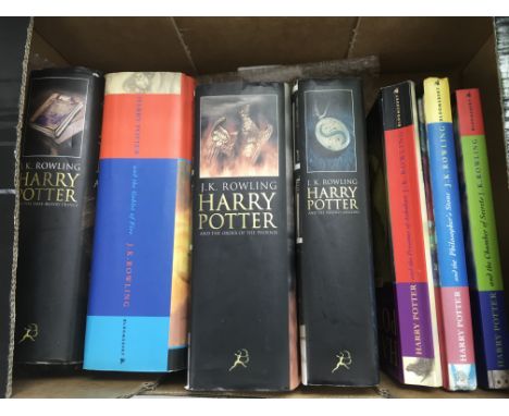 Another seven Harry Potter books comprising four first editions and three others.