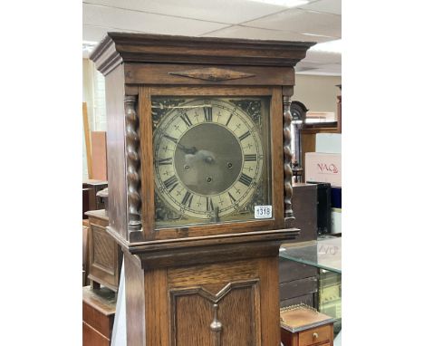 A 1930s oak longcase clock with brass dial - NO RESERVE