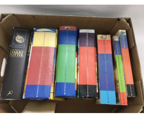 Seven Harry Potter books comprising four first editions and three others.