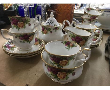 A Royal Albert tea set comprising cups, saucers, tea pot, sugar bowl, side plates