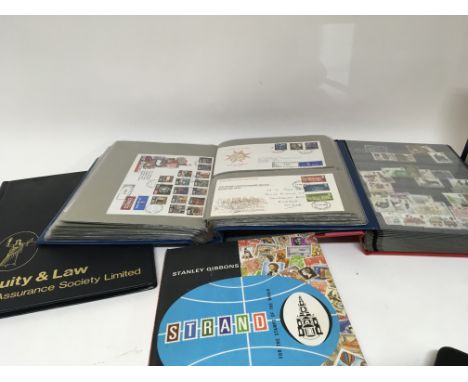 An album containing First day covers including a good collection of Maltese covers albums of British and world stamps mainly 