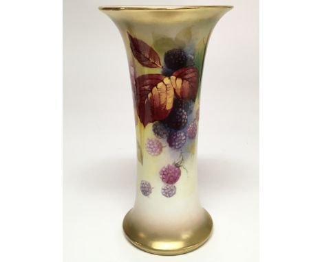 A Royal Worcester trumpet form vase painted with autumnal leaves and berries by Kitty Blake, signed K Blake. Circa 1931, the 