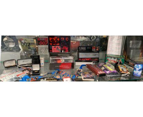 Excellent mixed lot of James Bond 007 memorabilia including Fossil Limited Edition Watch, badges, cuff links, pens and more.&
