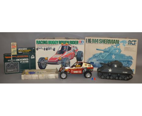 2 Tamiya kit built radio controlled models, an M4 Sherman Tank in 1/16 scale and a 1/10 scale Brach Buggy. Both models have b