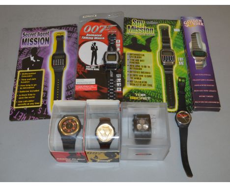 3 Swatch James Bond 007 related Wrist Watches, all cased,&nbsp; together with 4 carded/boxed 007/Spy related Digital Watches 