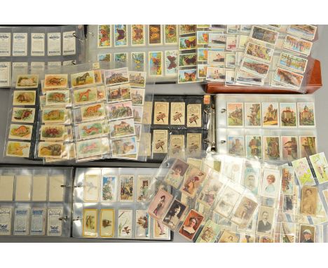 THREE ALBUMS, containing approximately one thousand four hundred cigarette and trade cards, a mixture of complete, incomplete