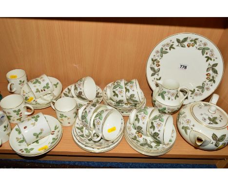 TWO WEDGWOOD TEA AND COFFEE SETS, to include 'Strawberry Hill' consisting of cake plate, teapot (spout chipped), milk jug, su