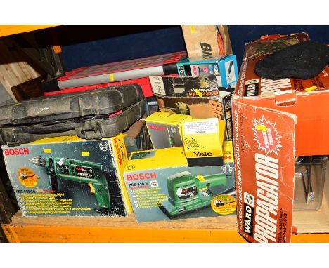 A PLASTIC AND METAL TOOL BOX containing various hand tools, together with various boxed electric hand tools including a Bosch