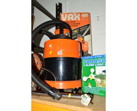 A VAX VACUUM CLEANER together with two boxed globe parasol lights (3)