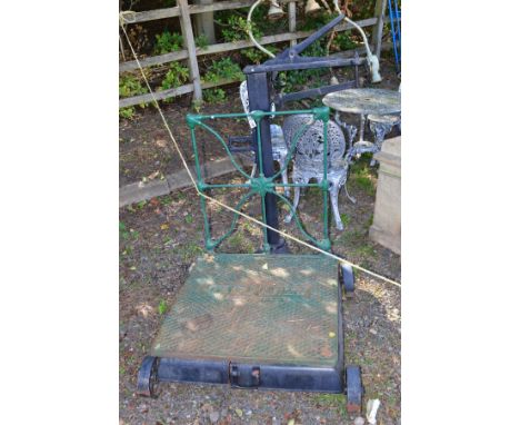 A VINTAGE CAST IRON FAIRBANKS, US WHEELED POTATO SCALE