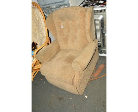 AN UPHOLSTERED MANUAL RECLINING ARMCHAIR