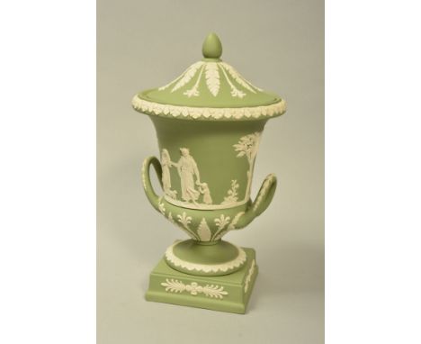 A WEDGWOOD GREEN JASPERWARE TWIN HANDLED VASE AND COVER, decorated with classical figures and foliage, on pedestal foot and s