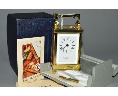 A CASED TAYLOR &amp; BLIGH BRASS CARRIAGE CLOCK, the white face with black Roman numerals, four shaped feet, glass front and 