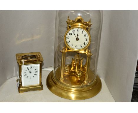 AN EARLY 20TH CENTURY FRENCH BRASS CARRIAGE CLOCK RETAILED BY HARRODS LTD, lacks oval top glass, height to handle up 14cm, to
