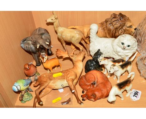 A GROUP OF BESWICK ANIMALS AND BIRDS, to include three Foxhounds, No 941 (three legs and tail reglued), No 942 (leg reglued),