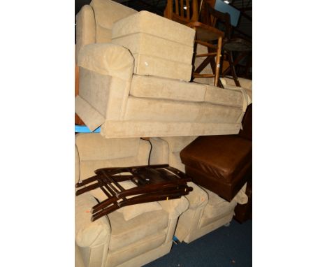 A CREAM UPHOLSTERED FOUR PIECE LOUNGE SUITE, comprising of a two seater settee, a pair of matching armchairs and a pouffe