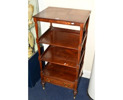 AN EDWARDIAN MAHOGANY FOUR TIER WHAT NOT, the top shelf with an adjustable top, cylindrical supports above a single drawer an