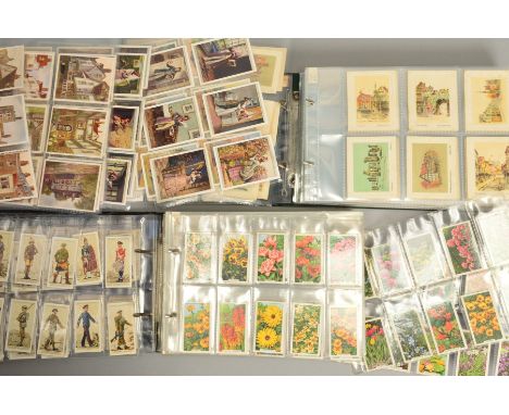 TWO CIGARETTE CARD ALBUMS, containing twenty sets of various manufacturers cigarette cards and a small number of odds, highli