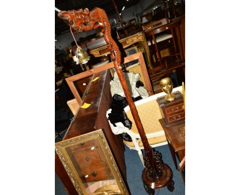 AN ORIENTAL HARDWOOD STANDARD LAMP in the form of a dragon with a dropped brass light fitting (no shade), height 182cm