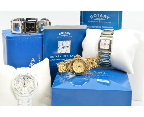 FOUR LADY'S WATCHES, to include a white metal Rotary, a yellow metal Rotary, a white Guess watch with mother of pearl face, a