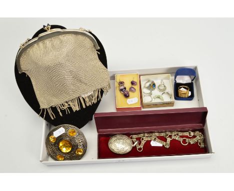 A SELECTION OF JEWELLERY, to include a large oval locket with engraved decoration suspended from a open wirework chain with s