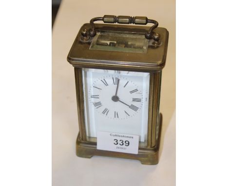 A VINTAGE BRASS CARRIAGE CLOCK