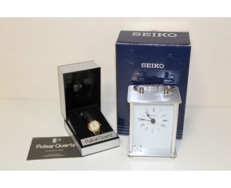 A CASED PULSAR WRIST WATCH, AND A CARRIAGE CLOCK (2)