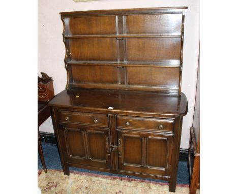 A DARK OAK ERCOL STYLE DRESSER W-122 CM