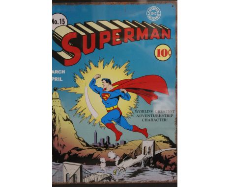 A FRAMED AND GLAZED REPRODUCTION ENAMEL PLAQUE OF A SUPERMAN COMIC COVER, OVERALL HEIGHT 58 CM